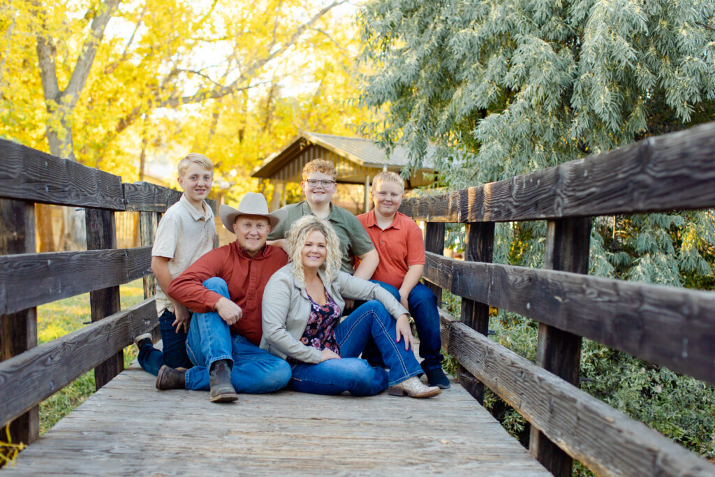 Light and Airy Family Photographs, Family posing on bridge, Royal Diamond Photography