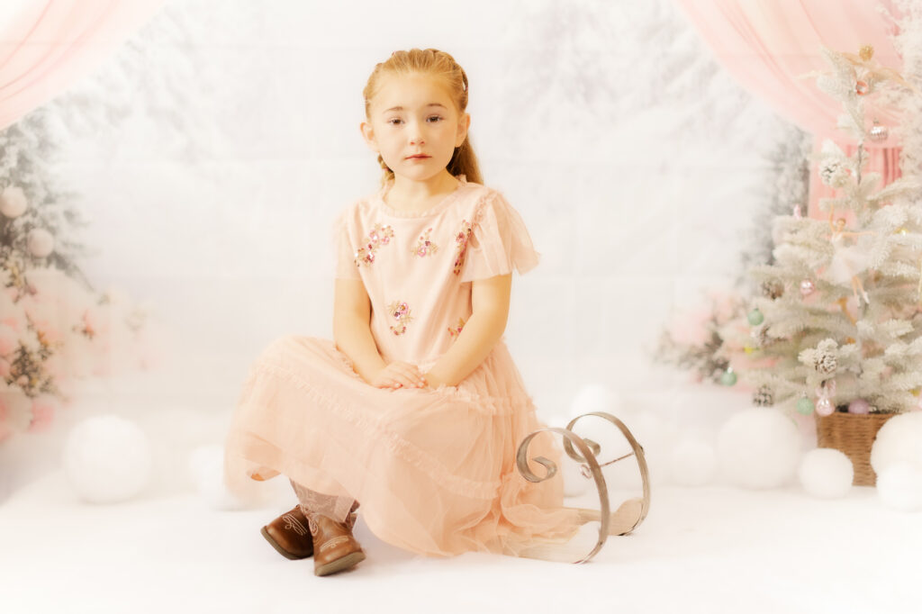 Young Girl Sitting on a Sled