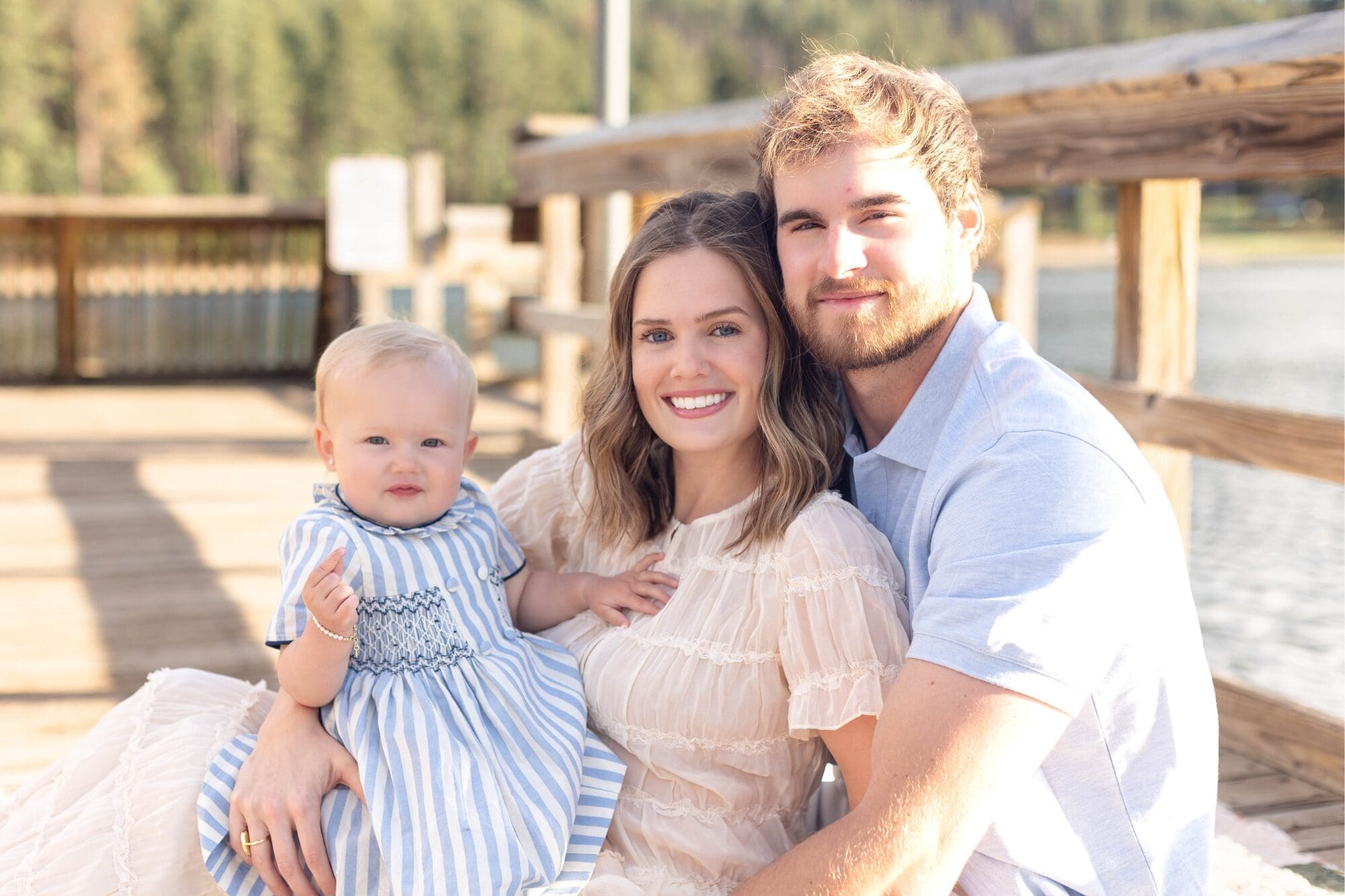 Family sitting on dock at iron creek lake